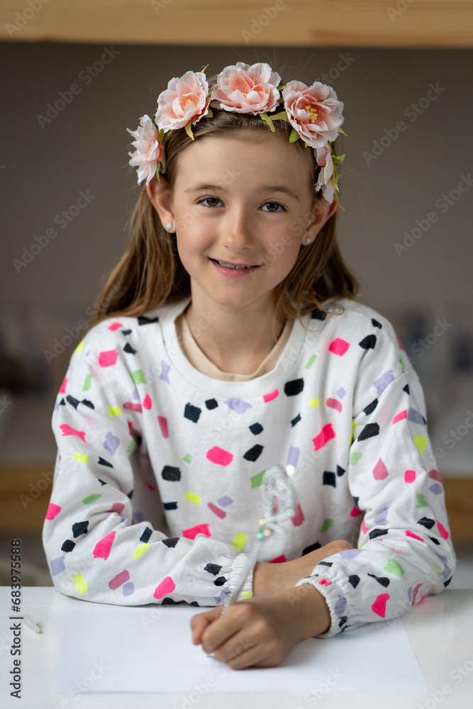 happy little girl in her play room making fun toy colours laugh