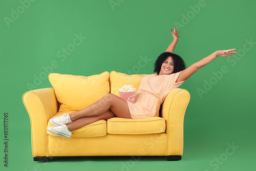 Beautiful woman with popcor...