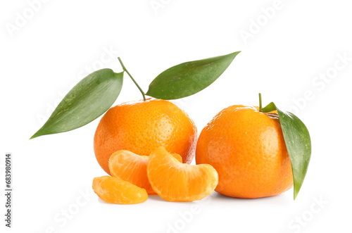 Sweet mandarins with leaves on white background photo