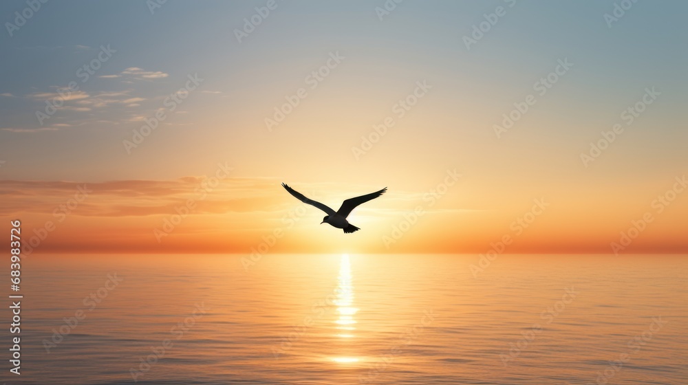 Fototapeta premium a bird flying over a body of water with the sun setting in the sky above the water and behind it is a large body of water with a bird flying in the foreground.