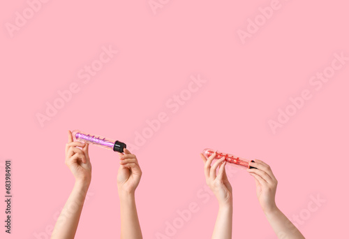 Female hands with vibrators...