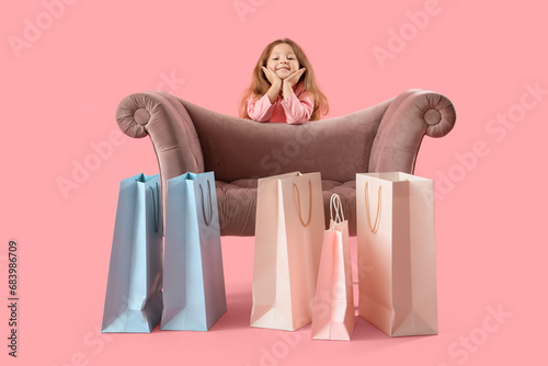 Cute little girl with shopp...