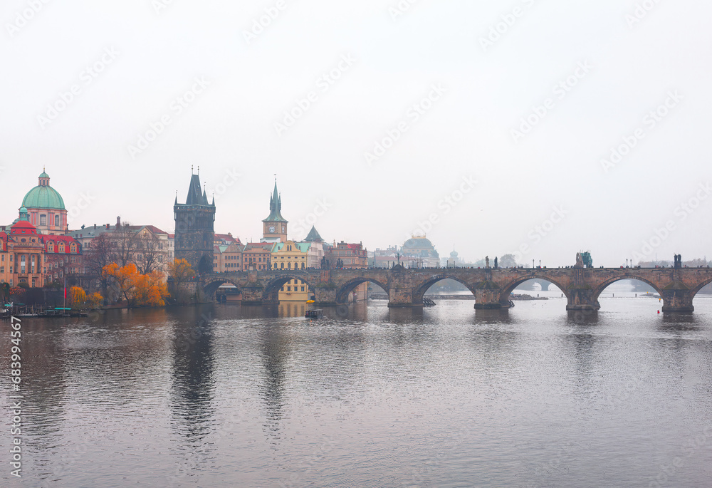 Charles Bridge over Vltava river in Prague, Czech Republic on a foggy day