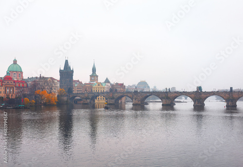 Charles Bridge over Vltava river in Prague, Czech Republic on a foggy day