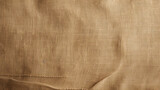 Gros plan, zoom sur un morceau de tissu beige. Tissu, textile, matière. Pour conception et création graphique.