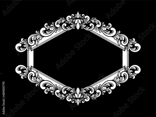 a black and white floral frame on a black background