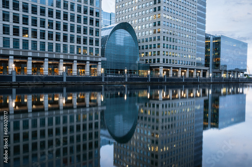 Reflections of corporate buildings in water, Canary Wharf, London