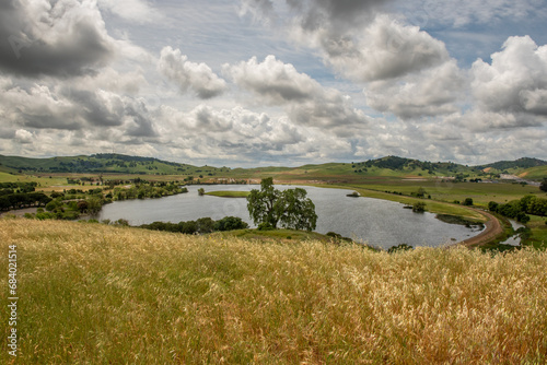 The Lagoon Valley Park in Vacaville, California, USA, viewed from a hill, on a beautiful partly cloudy spring day