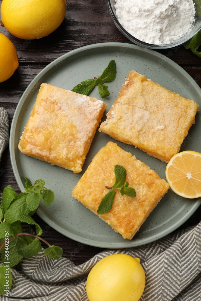 Tasty lemon bars served on wooden table, flat lay Tasty lemon bars served on wooden table, flat lay