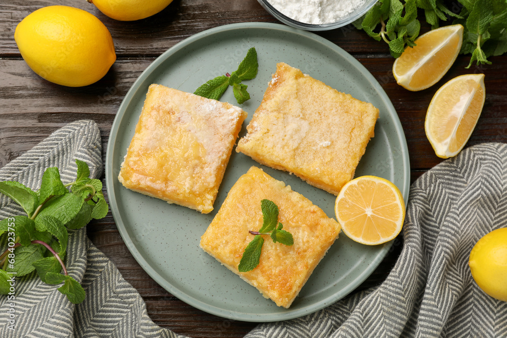 Tasty lemon bars served on wooden table, flat lay Tasty lemon bars served on wooden table, flat lay