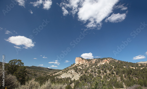 Mesa butte under blue sky in Little Book Cliffs National Monument near Grand Junction Colorado United States photo