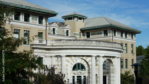 The beautiful campus view with the old buildings and green meadow in the university