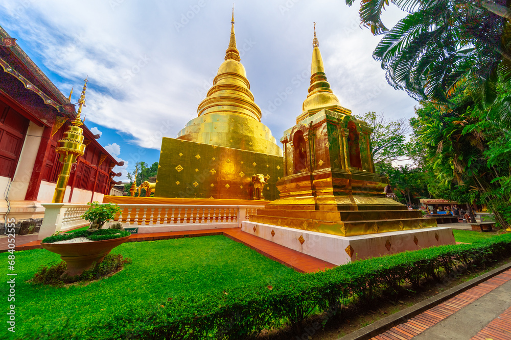 Fototapeta premium Beautiful Wat Buddhist temples in Chiangmai Chiang mai Thailand. Decorated in beautiful ornate colours of red and Gold and Blue. Lovely sunset