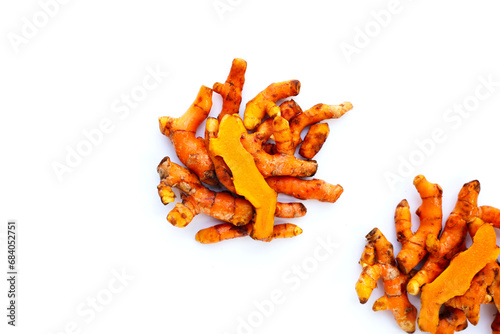 Turmeric roots on white background.