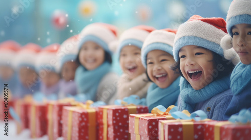 Happy asian kids in Santa hats with presents in kindergarten