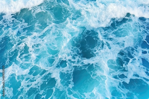 Aerial view to ocean waves blue water background