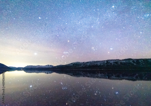 Perfect Winter Night Sky Reflection In Glacier National Park photo