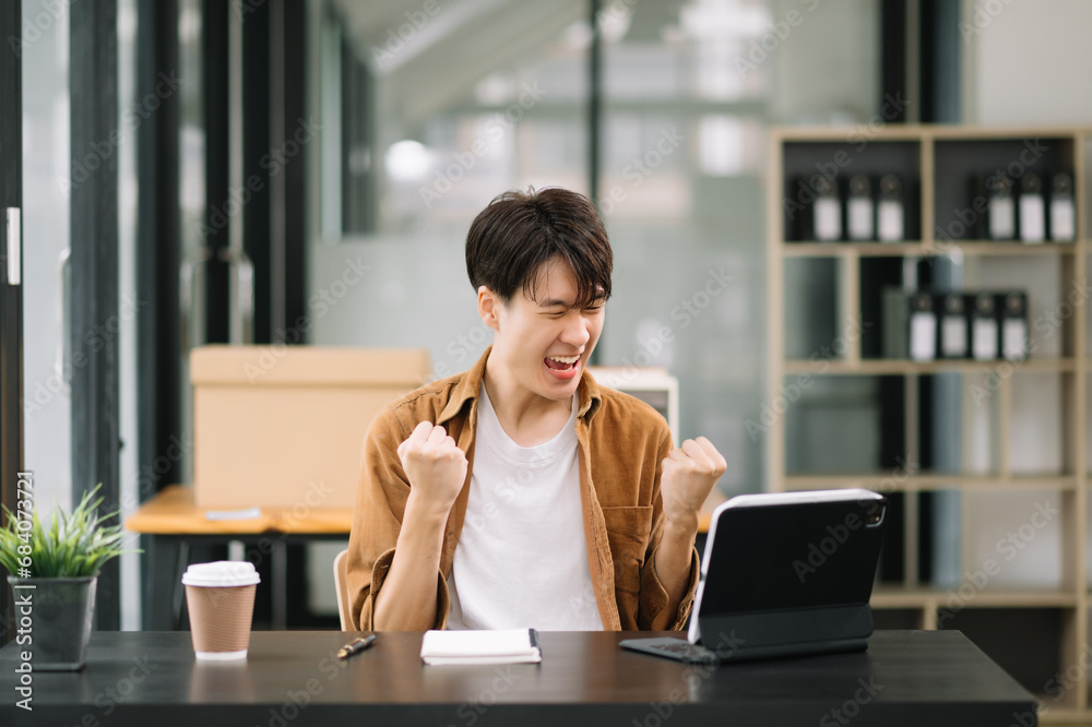 Asian businessman are delighted and happy with the work they do on their tablet, laptop at office. Asian businessman are delighted and happy with the work they do on their tablet, laptop at office.