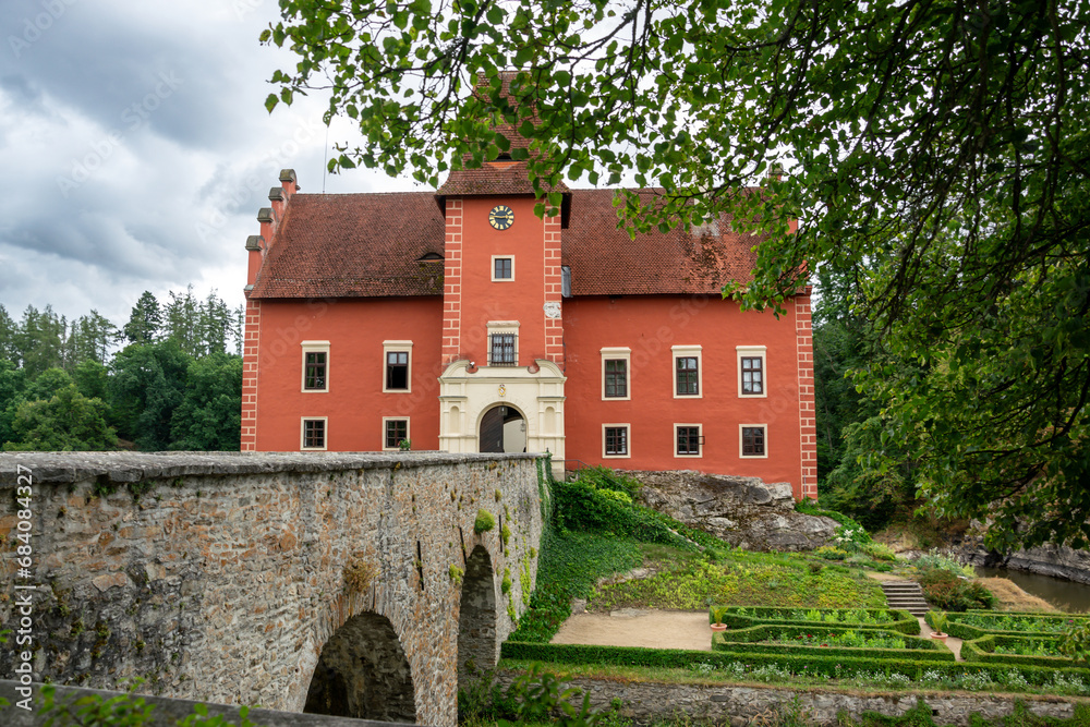 The old castle Červená lhota in South Bohemia. A castle with a brick bridge over a lake. Tourist attraction in the Czech Republic.