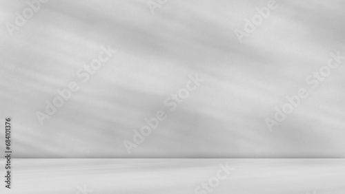 Empty gray room studio with shadow on wall and floor for product presentation. Sunlight and shadow concept. Minimal summer backdrop design. Cosmetic, beauty and fashion showroom mock up.