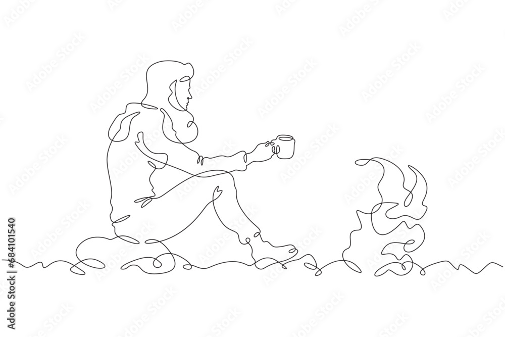 A tourist sits by the fire. A girl drinks a hot drink by the fire on a hike. A stop on the journey. One continuous line drawing. Linear. Hand drawn, white background. One line.