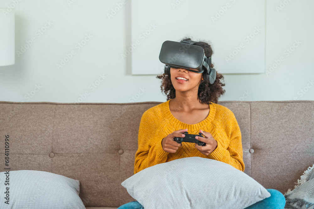 African American teenage woman using Virtual Reality Glasses having fun with Game VR simulator. African American teenage woman using Virtual Reality Glasses having fun with Game VR simulator.