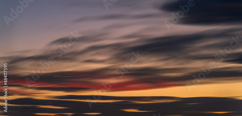 Peaceful Dusk: A Long Exposure of Clouds at Sunset © F.C.G.