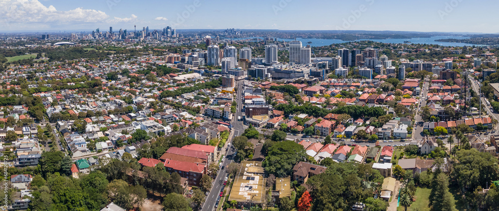 Panoramic aerial drone view of Bondi Junction in the Eastern Suburbs of Sydney, NSW Australia with Sydney City in the background on a sunny day