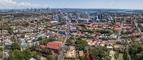 Panoramic aerial drone view of Bondi Junction in the Eastern Suburbs of Sydney, NSW Australia with Sydney City in the background on a sunny day