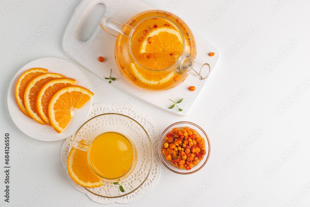 Sea buckthorn tea drink with oranges and mint. Autumn comfort hot drink. Herbal vitamin tea. Sea buckthorn tea drink with oranges and mint. Autumn comfort hot drink. Herbal vitamin tea.