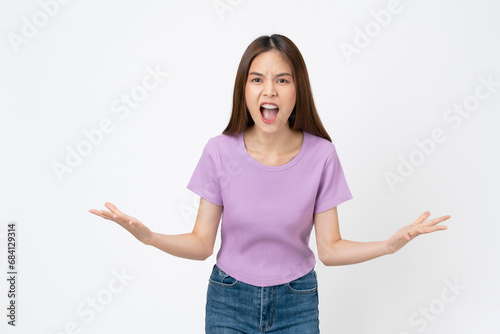 Confused young woman shrugging shoulders, isolated on white background. photo