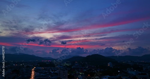 .aerial view The lights twinkled along Talang walking street at night..Bright colors along the beach city area at night..beautiful sky in twilight. photo