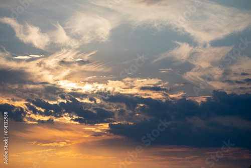 Orange sunrise on the horizon with emphasis on the sun's rays and birds in the distance. Idyllic Setting