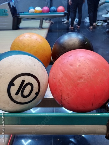 Bowling ball and pins on the table