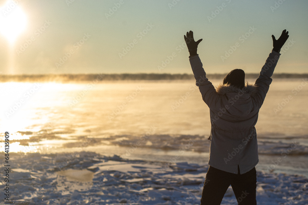 Happy girl kicking snow on beautiful winter day. High quality photo Happy girl kicking snow on beautiful winter day. High quality photo