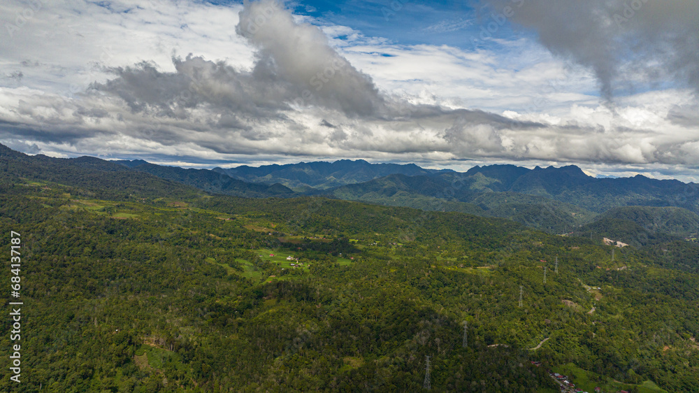 Aerial view of mountains with rainforest and clouds. Sumatra, Indonesia.