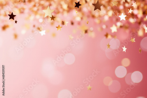 Gold star confetti on pink glittery festive background with space  photo