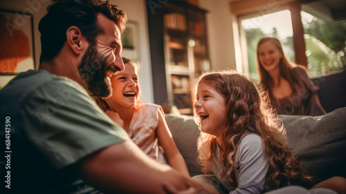 Happy big family laughing together in the domestic house background.