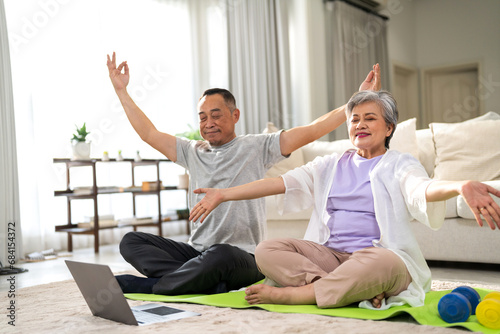 Portrait sport senior asian couple training and sitting relax practicing yoga, elderly health, fitness, exercise, wellness, workout, sport at home.retirement concept.Fitness, senior healthy lifestyle