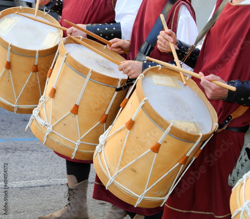 drum players with medieval clothes and ancient instruments during the historical re-enactment through the streets