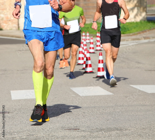 senior runner in sports outfit during foot race photo