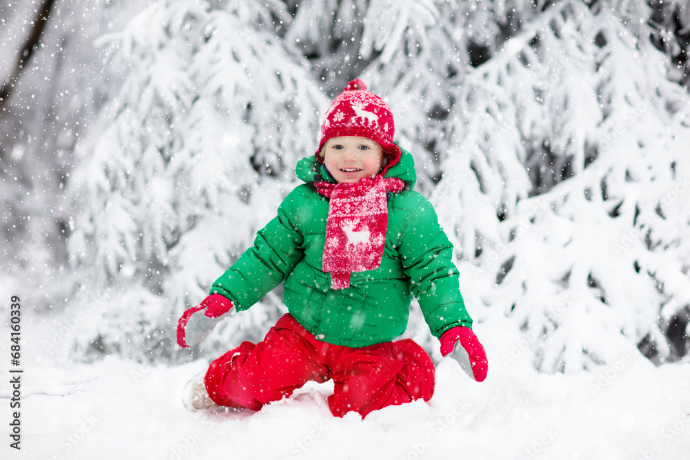 Boy on sleigh ride. Child sledding. Kid with sledge Boy on sleigh ride. Child sledding. Kid with sledge