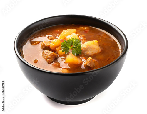 Goulash soup black bowl isolated on white background, cutout