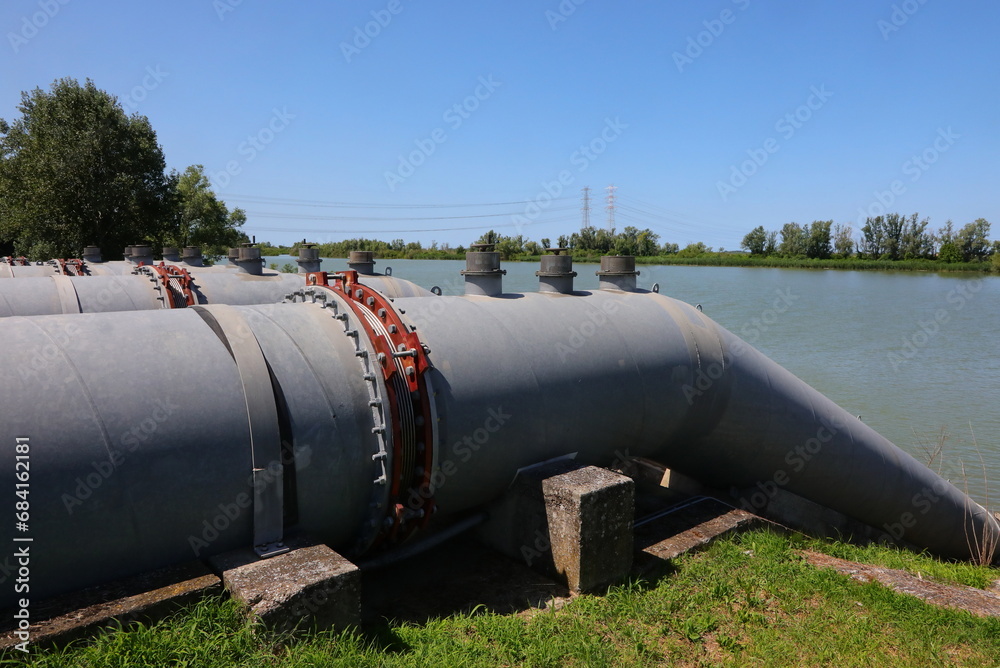 pipes from the Idrovore for drying out canals to avoid river flooding and to water the fields in periods of drought pipes from the Idrovore for drying out canals to avoid river flooding and to water the fields in periods of drought