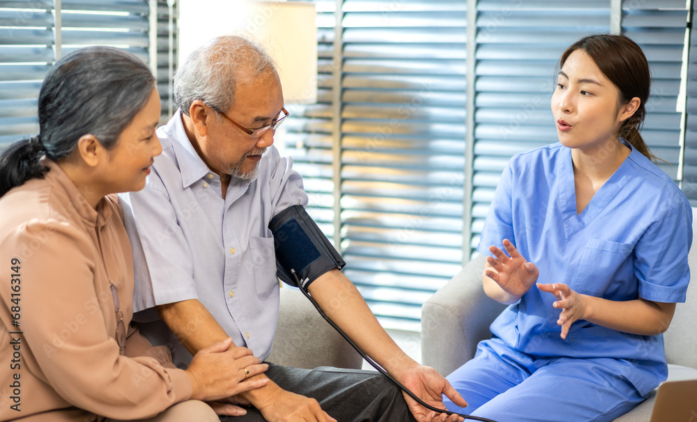 Obraz premium Portrait of smiling caring asian nurse service help support discussing and consulting taking care with senior elderly asian man and woman couple at home visit.senior retirement home care concept