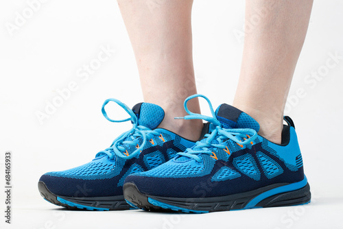 Sale of sneakers. Light blue running shoes on a white background.