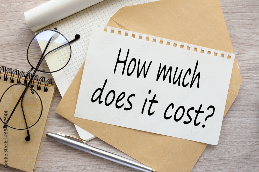 How Much Does it Cost. text on the page on the envelope How Much Does it Cost. text on the page on the envelope