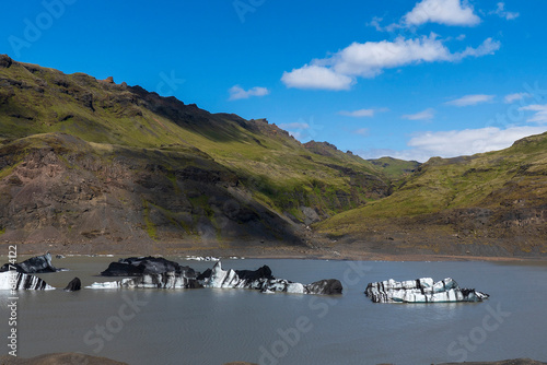 Bergy bits or growlers broken off from Solheimajokull, a glacier tongue of the Myrdalsjokull glacier. Katla Global Geopark, Iceland. photo