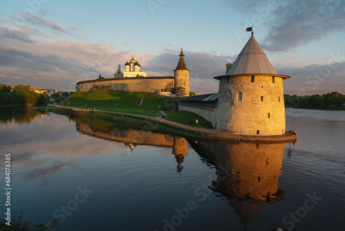 Pskov Kremlin, Russia, at sunset, illuminated by the rays of the sun. photo