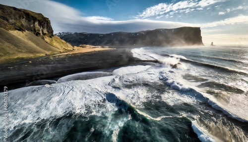 aerial photography of waves crashing on a black sand beach in iceland